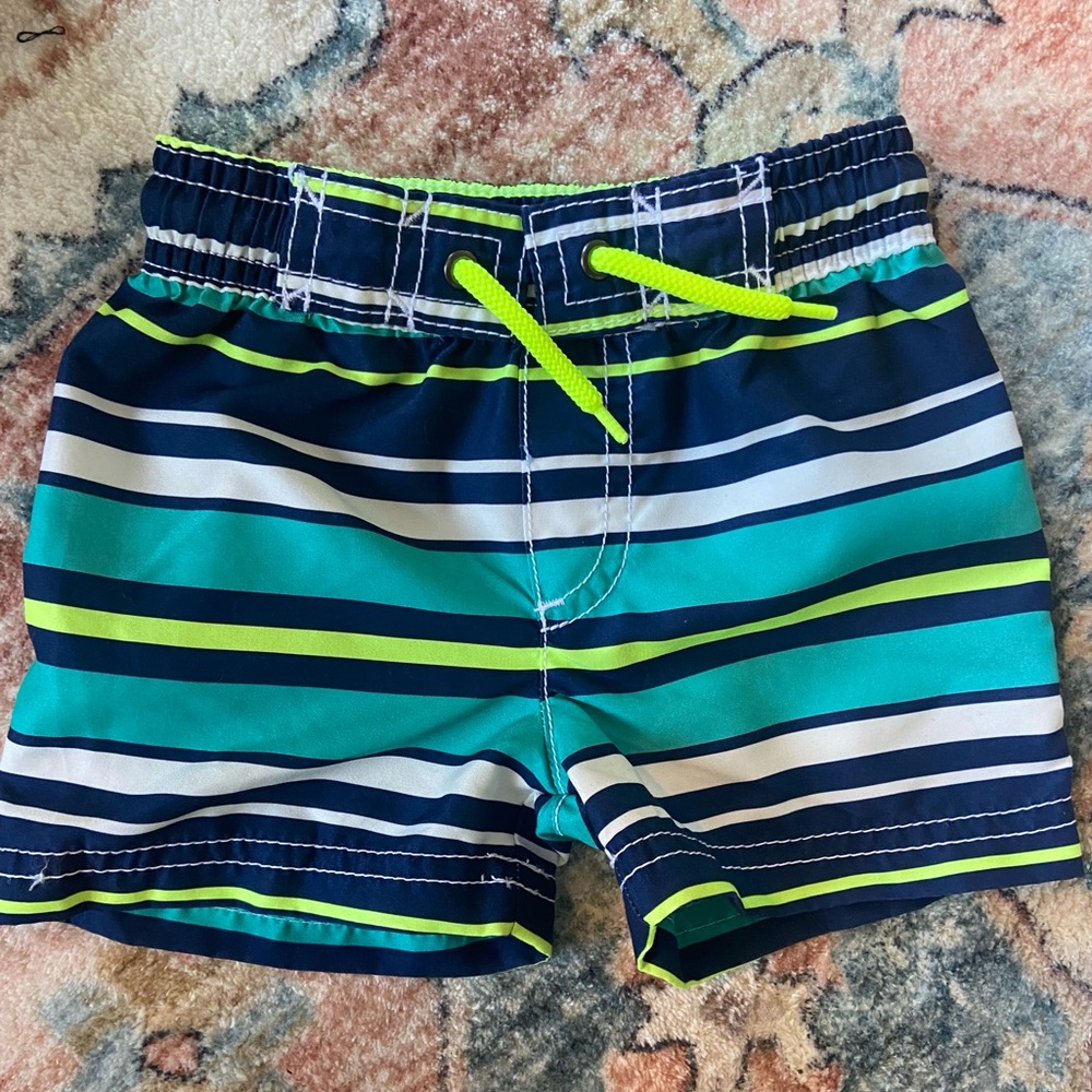 Never worn 9m baby boy Carter’s swim trunks